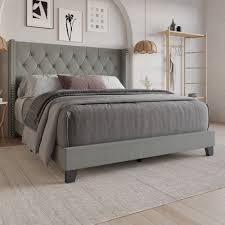 grey doted muffed tufted bed